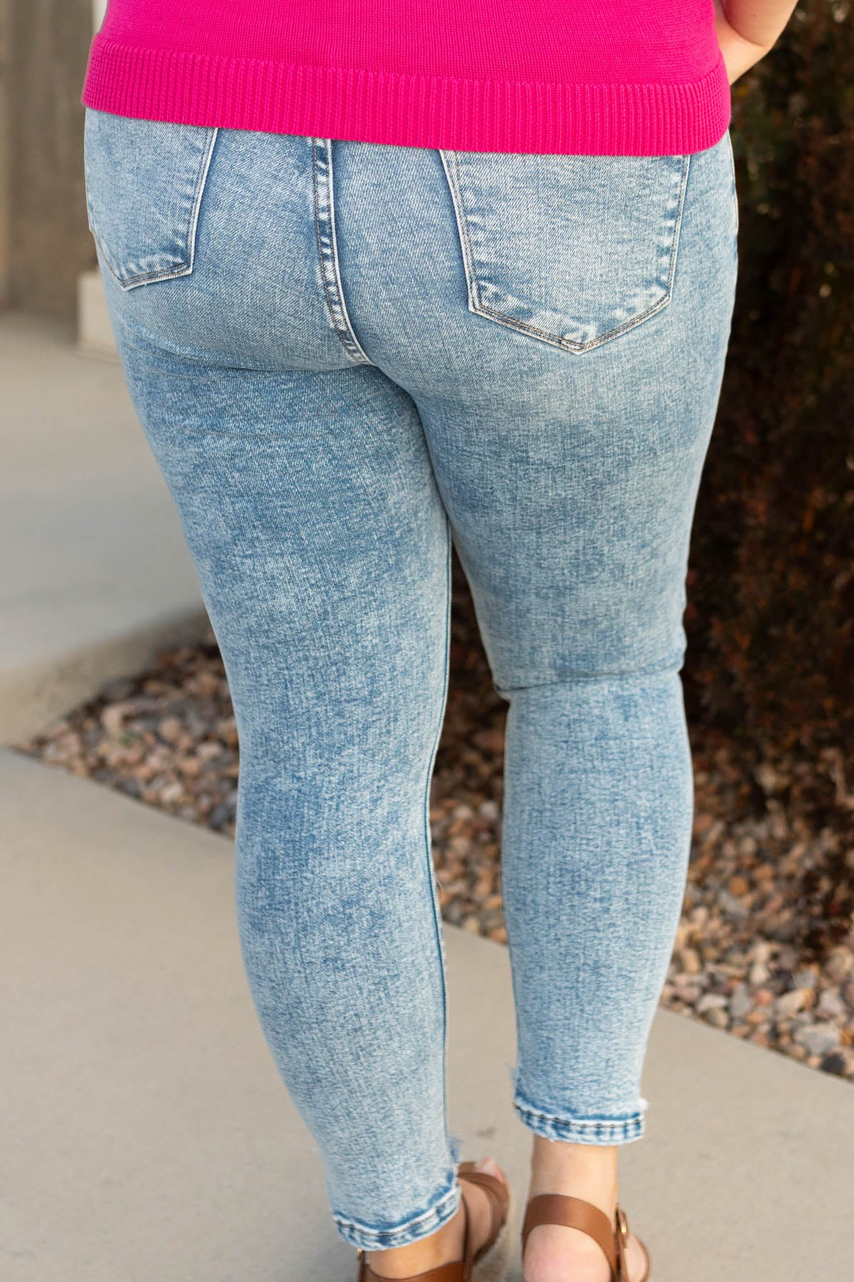 Back view of plus size medium wash jeans
