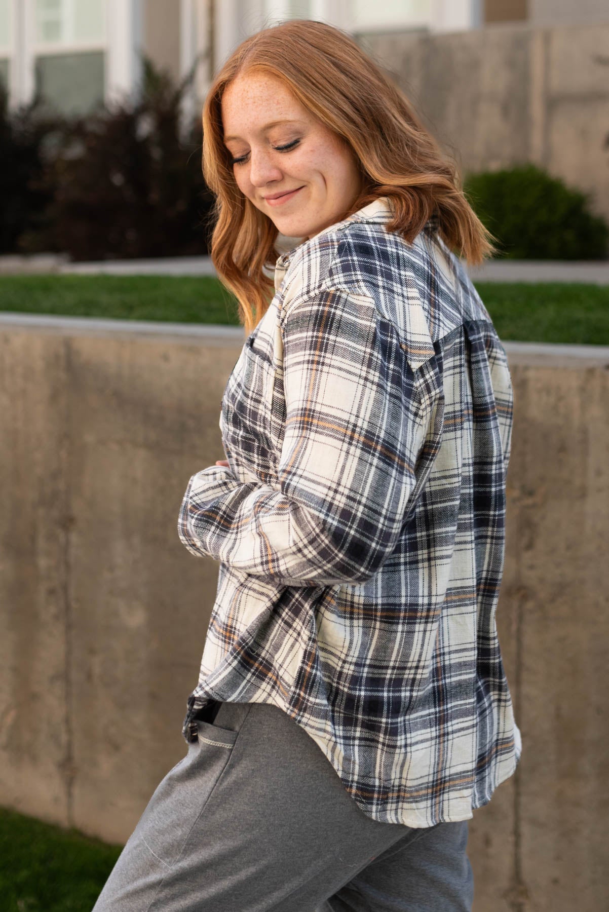 Side view of a black plaid top