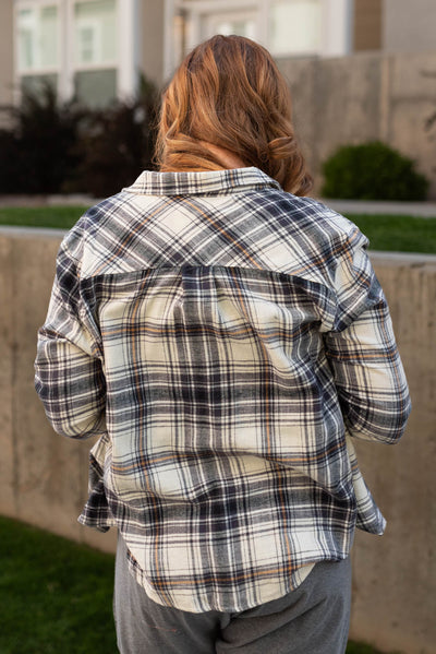 Back view of a black plaid top