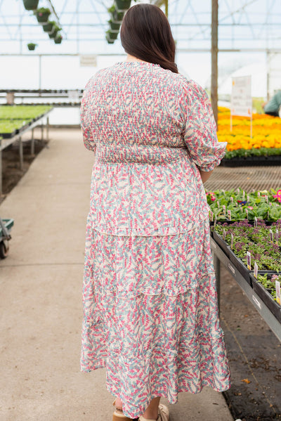 Back view of the plus size blue floral smocked dress