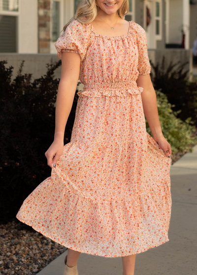 Short sleeve salmon floral dress with ruffle at the waist