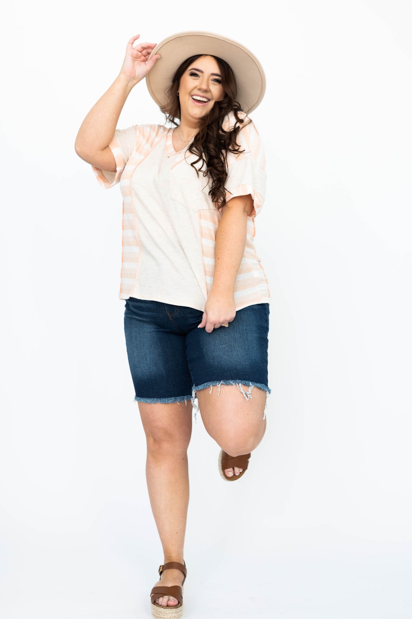 Plus size dark wash shorts with frayed edge and plus size oatmeal top that is sold separately