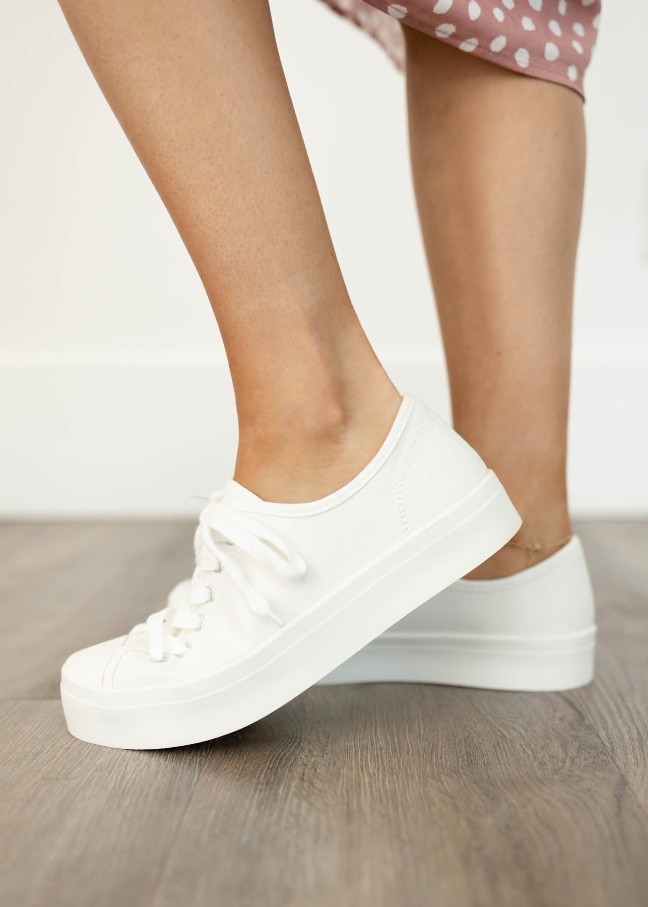 Side view of white sneakers