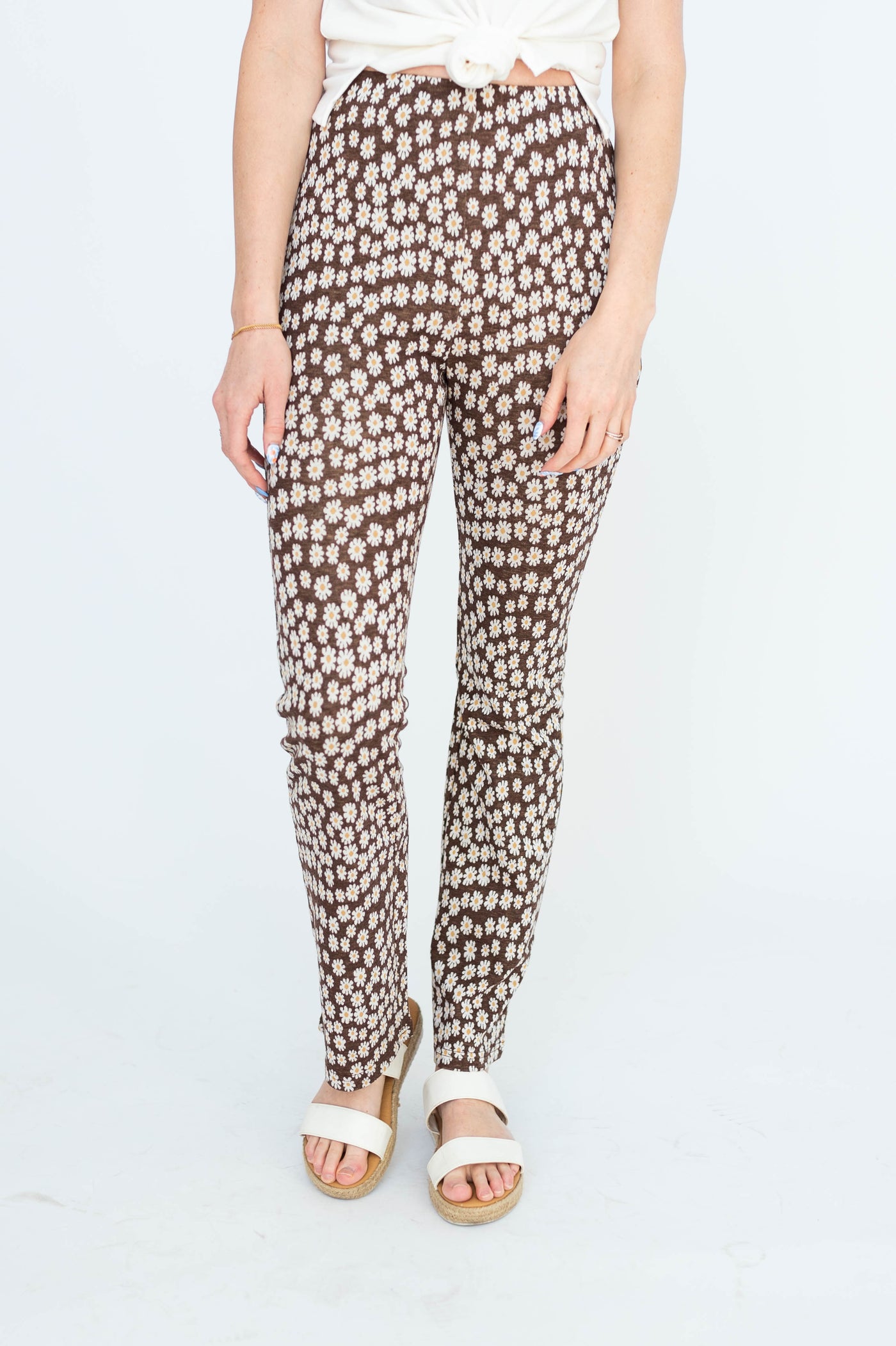 Front view of knit brown floral pants