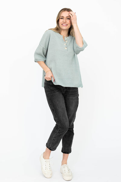 Front view of a dusty sage top with short sleeves