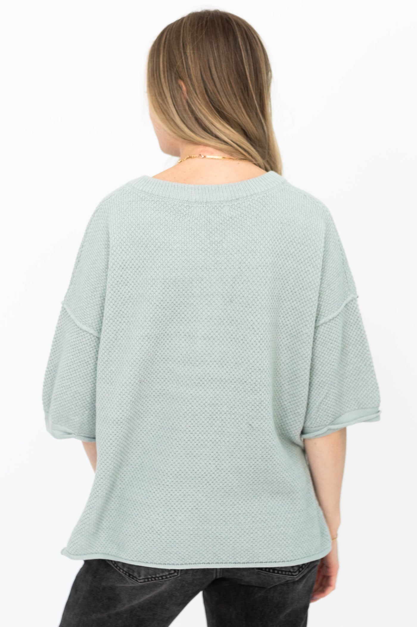 Back view of a dusty sage top