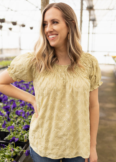 Sage top with short sleeves and smocking around the neck