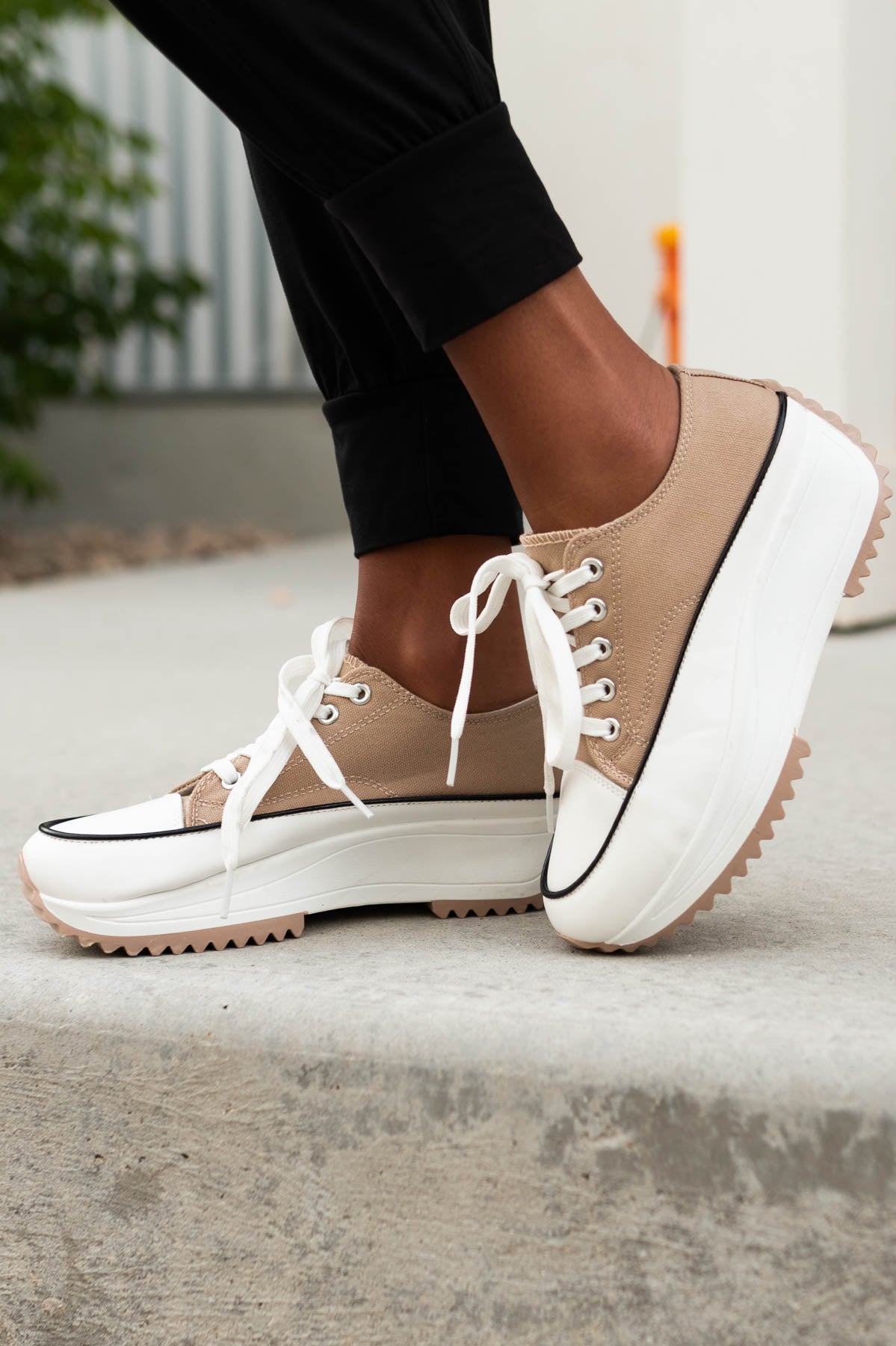 Side view of platform nude sneakers