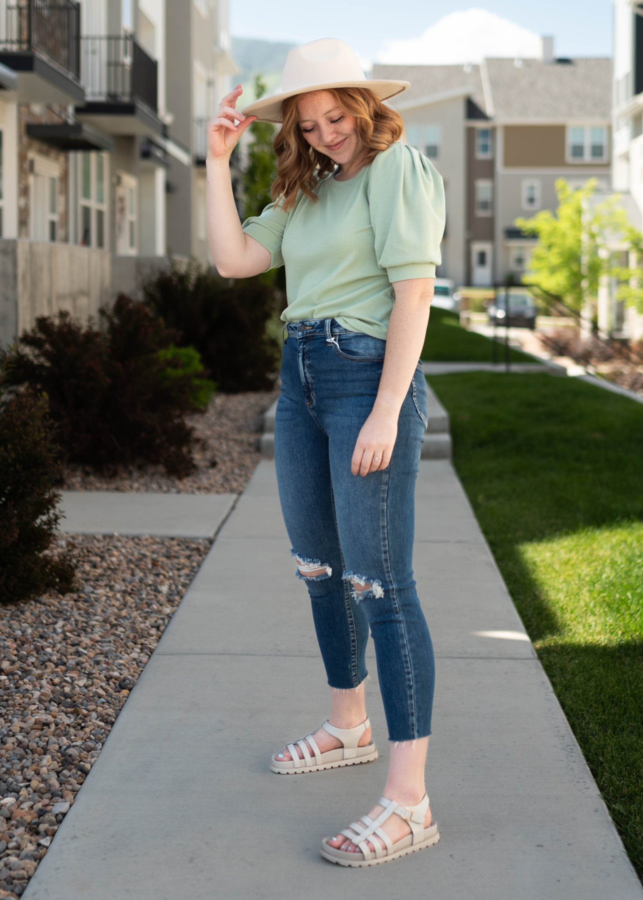 Side view of a sage top with short sleeves