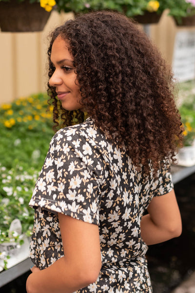 Side view of the black floral top