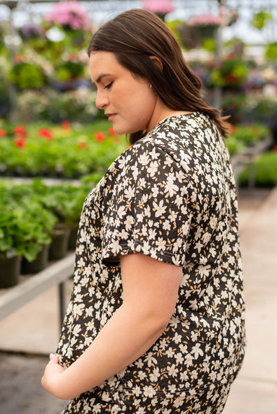 Side view of the black floral top