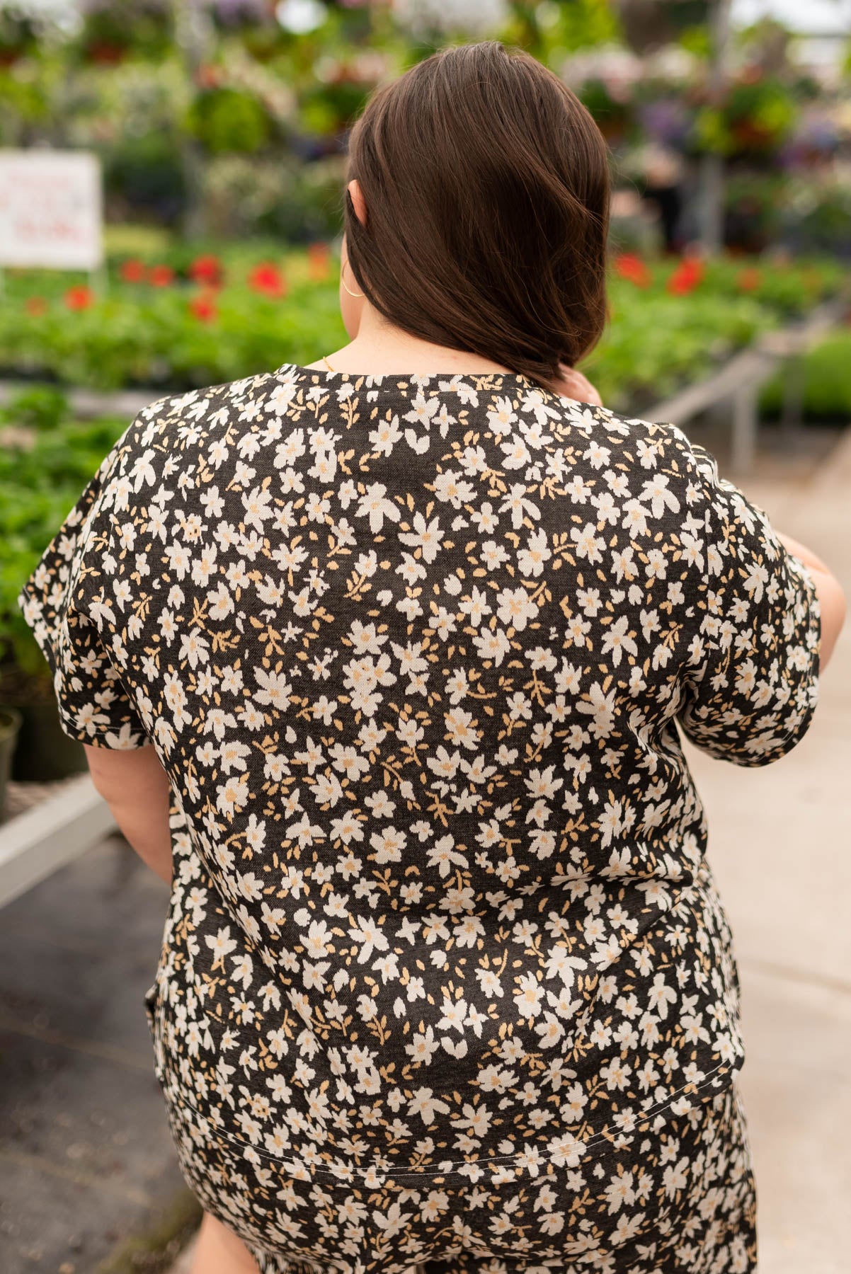 Back view of the plus size black floral top