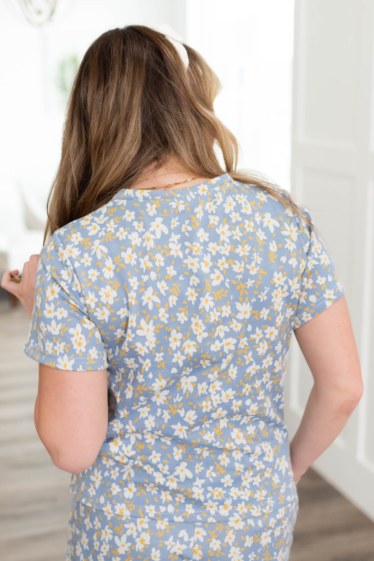 Back view of the blue floral top