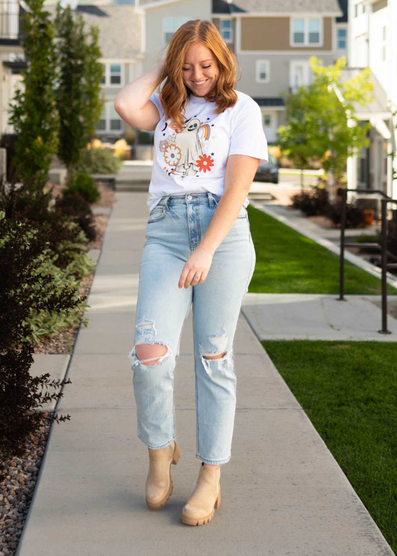 Distressed light jeans with button up fly