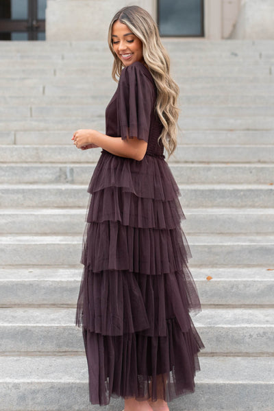Side view of a plum sweetheart tiered dress