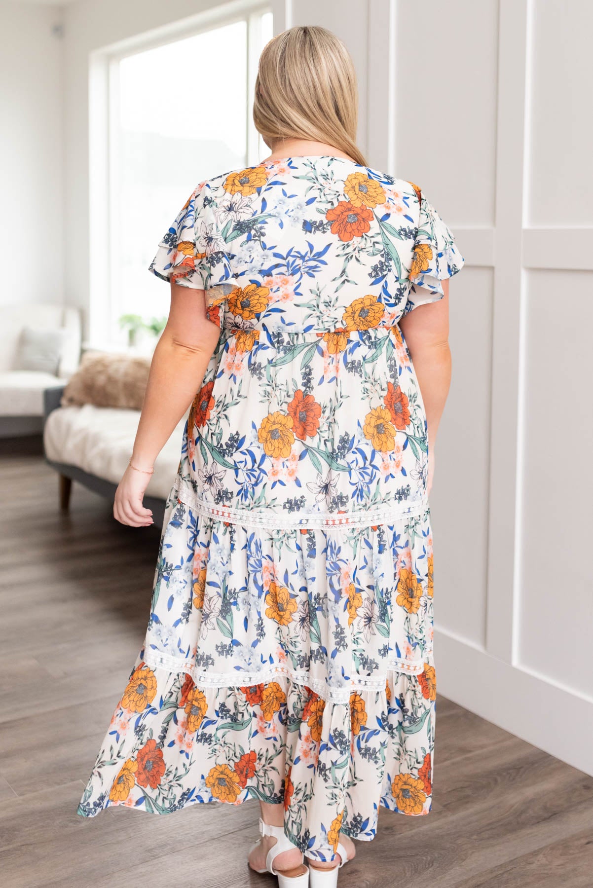 Plus size back view of the cream floral tiered dress