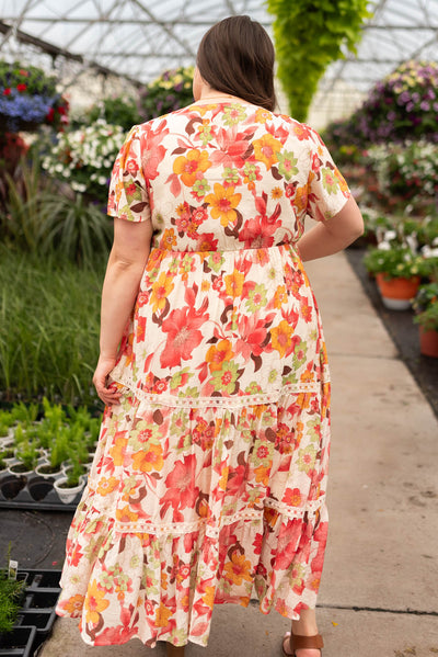 Back view of the plus size red multi floral tiered dress