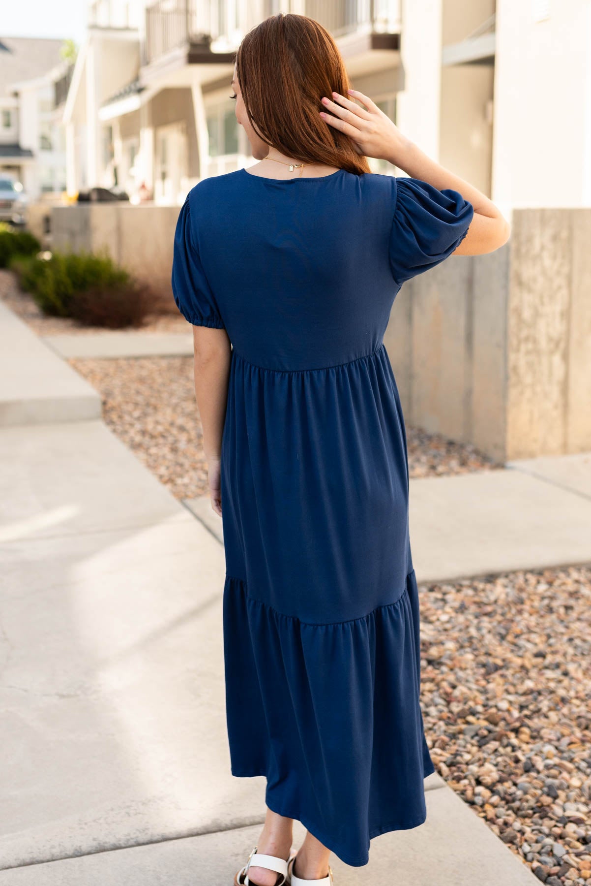 Back view of the navy tiered dress