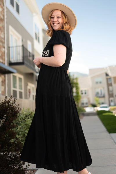 Side view of a short sleeve black dress