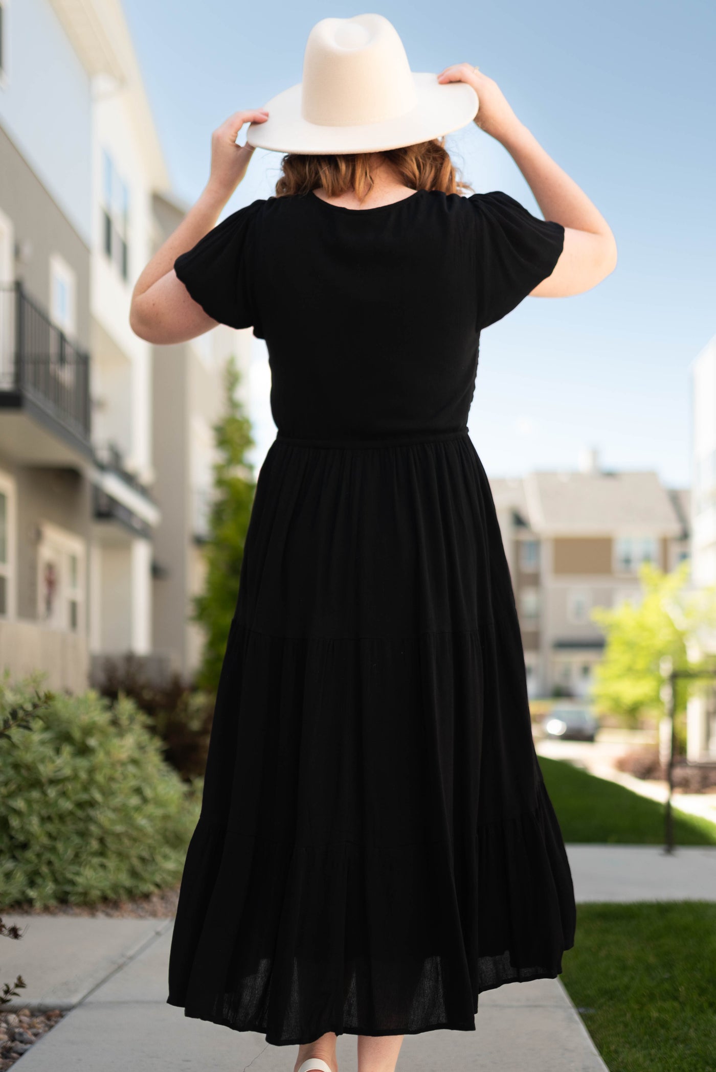 Side view of a black short sleeve dress