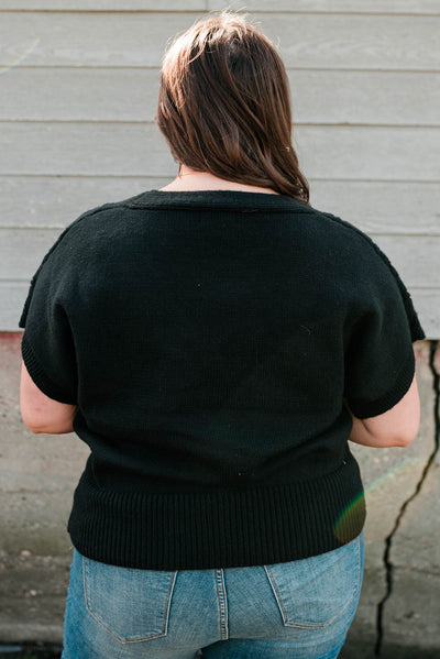 Back view of the plus size black knit cardigan
