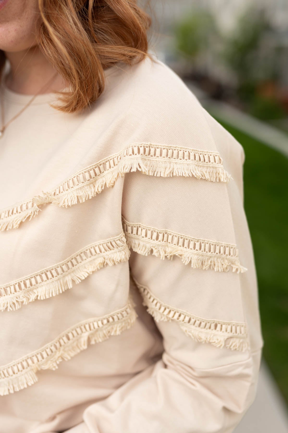 Close up of a beige pullover