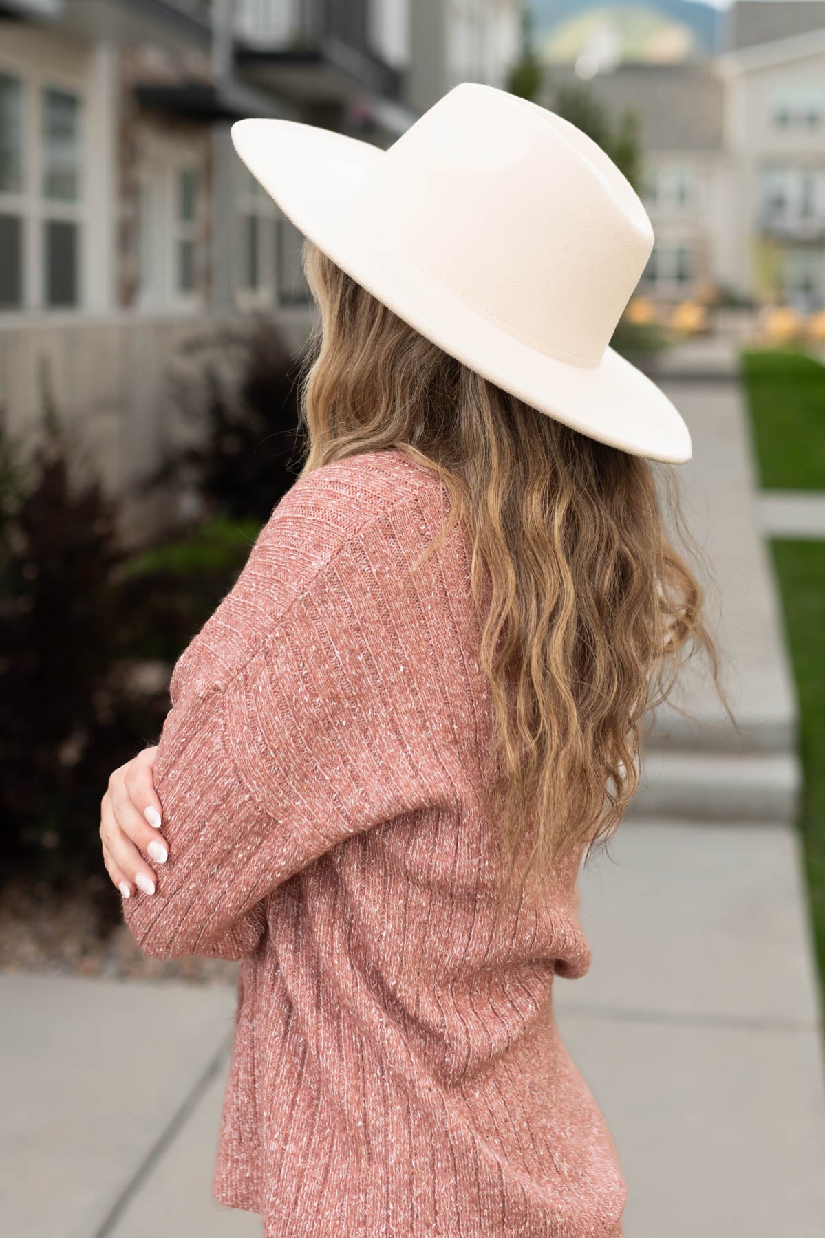 Side view of a blush cardigan
