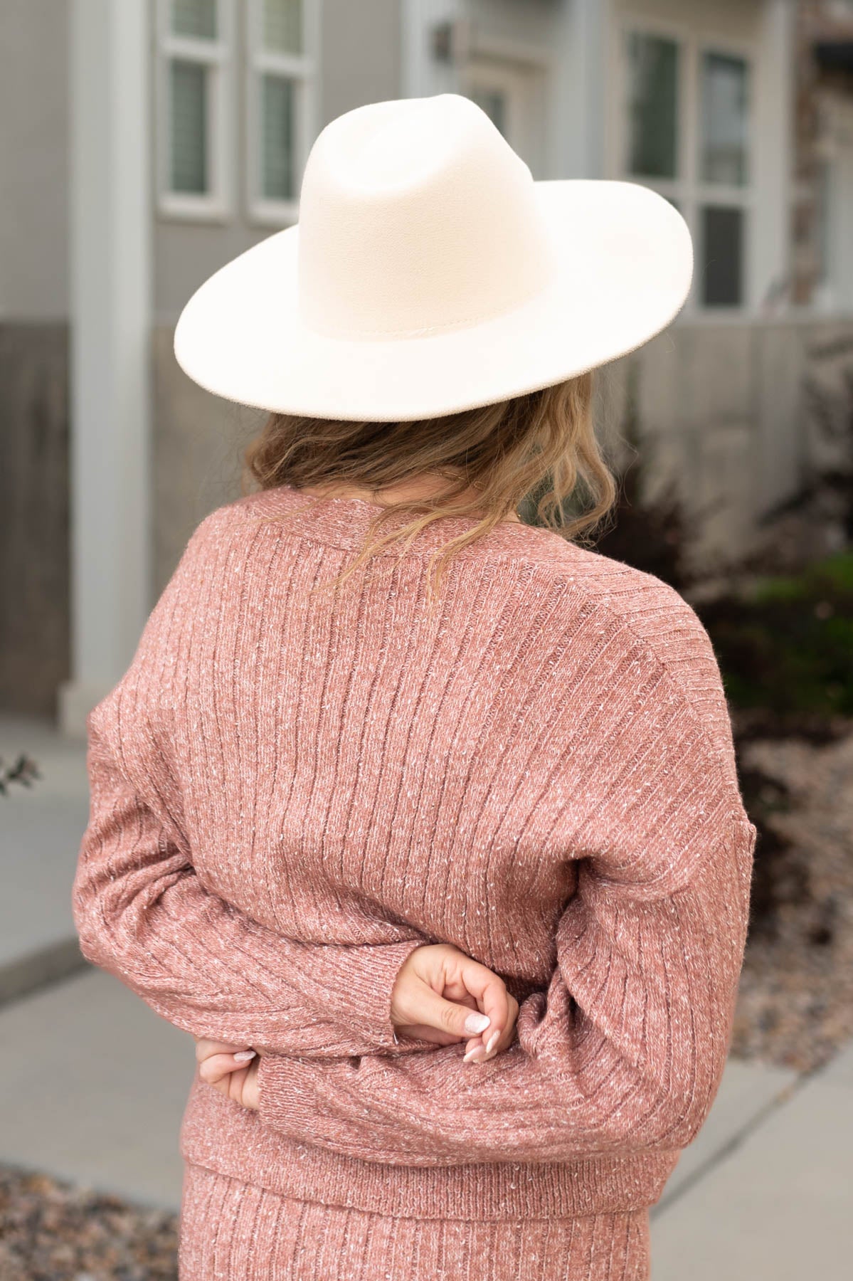 Back view of a blush cardigan