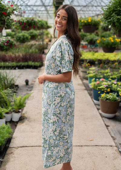 Side view of the blue flroal button down dress