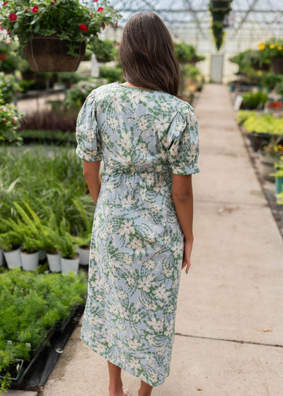 Back view of the blue floral button down dress