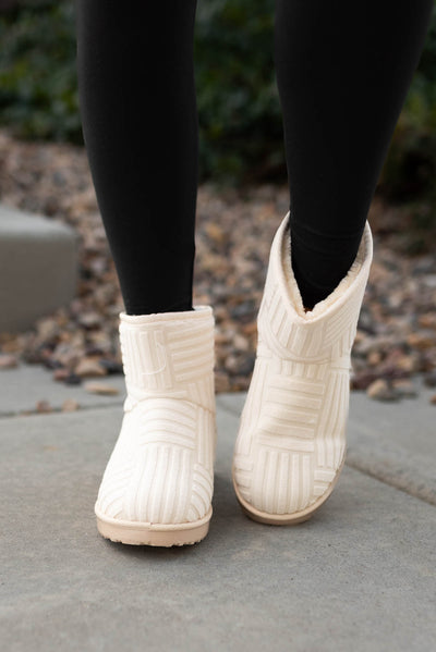 Front view of cream boots