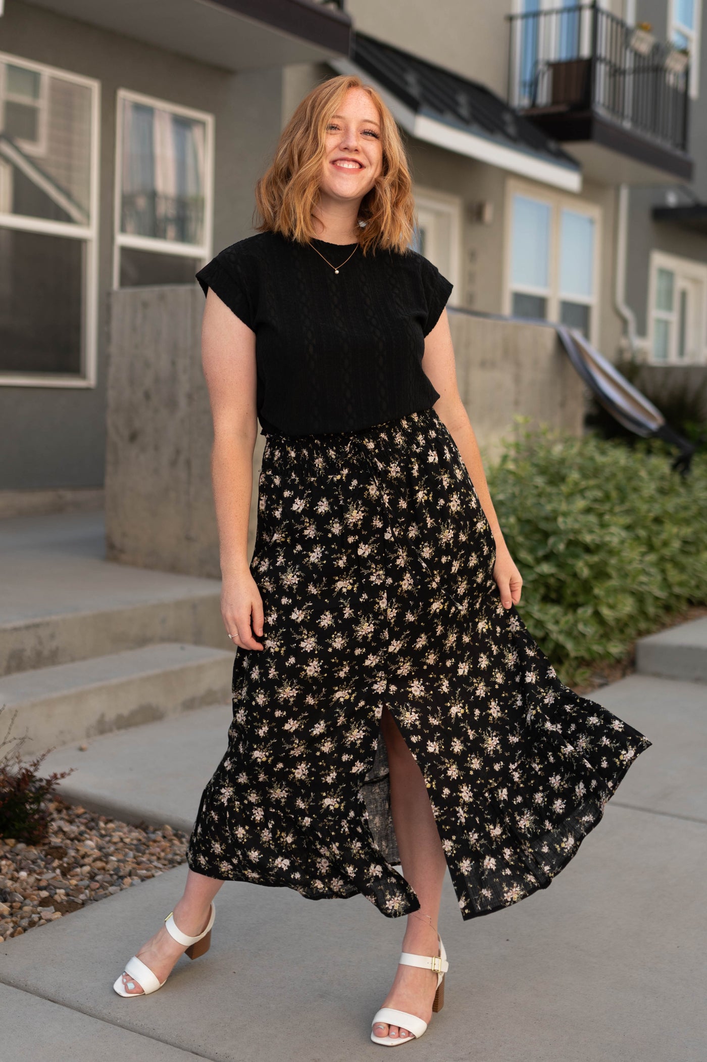 Cap sleeve black top with black floral skirt that is sold separately
