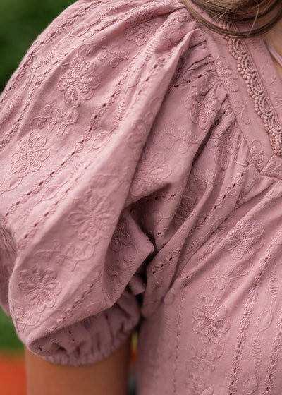 Close up of the sleeve on the dusty mauve embroidered dress