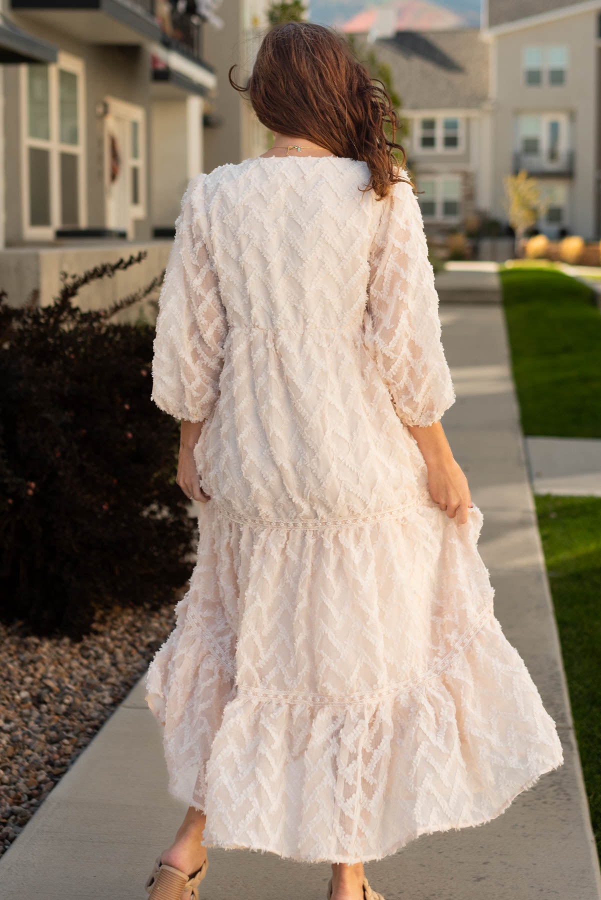 Back view of a cream dress