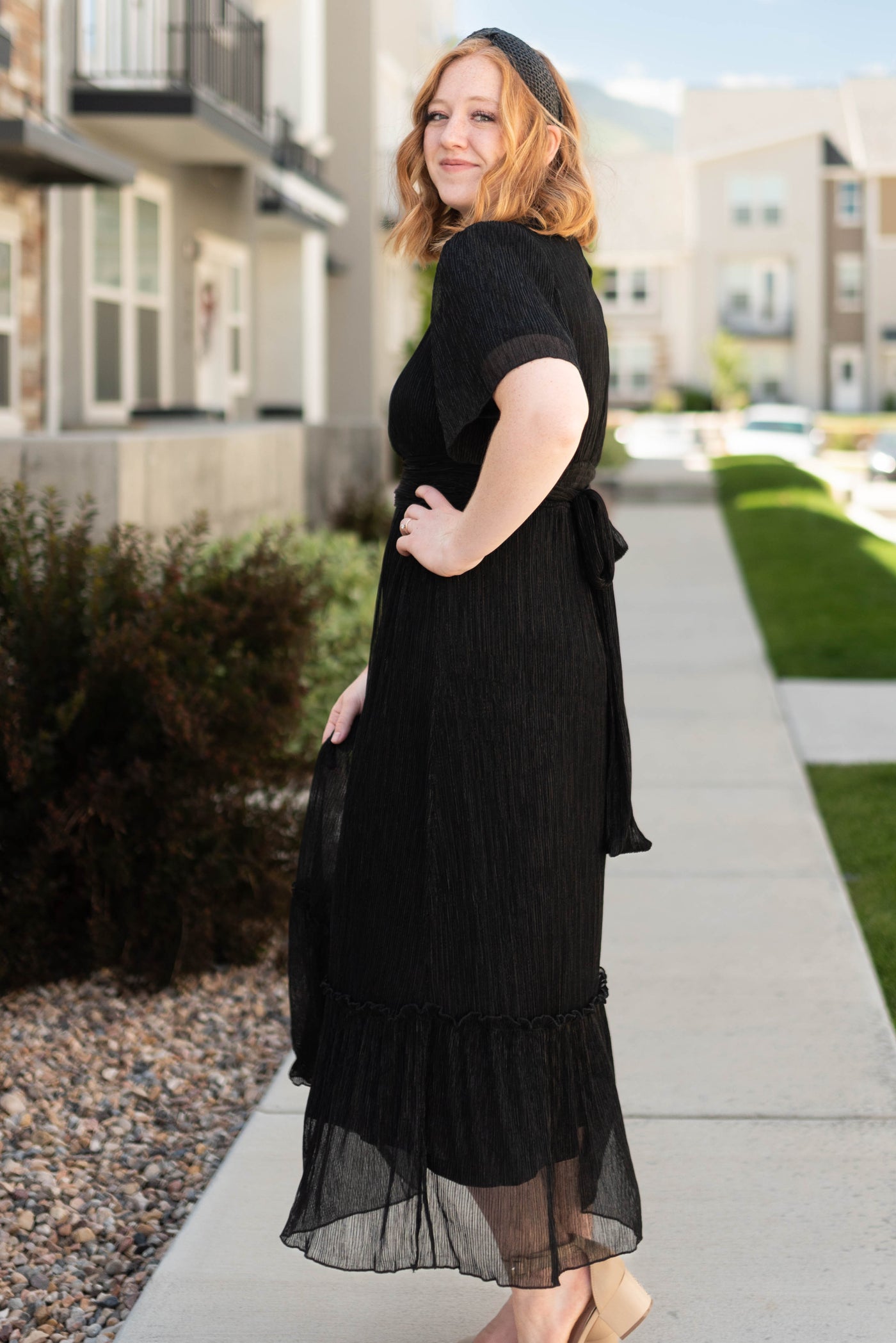 Side view of a short sleeve black dress 
