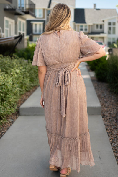Back view of a champagne dress that ties in the back