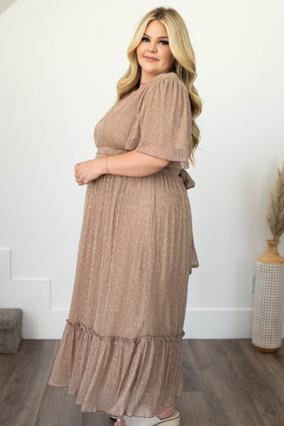 Side view of a plus size champagne dress