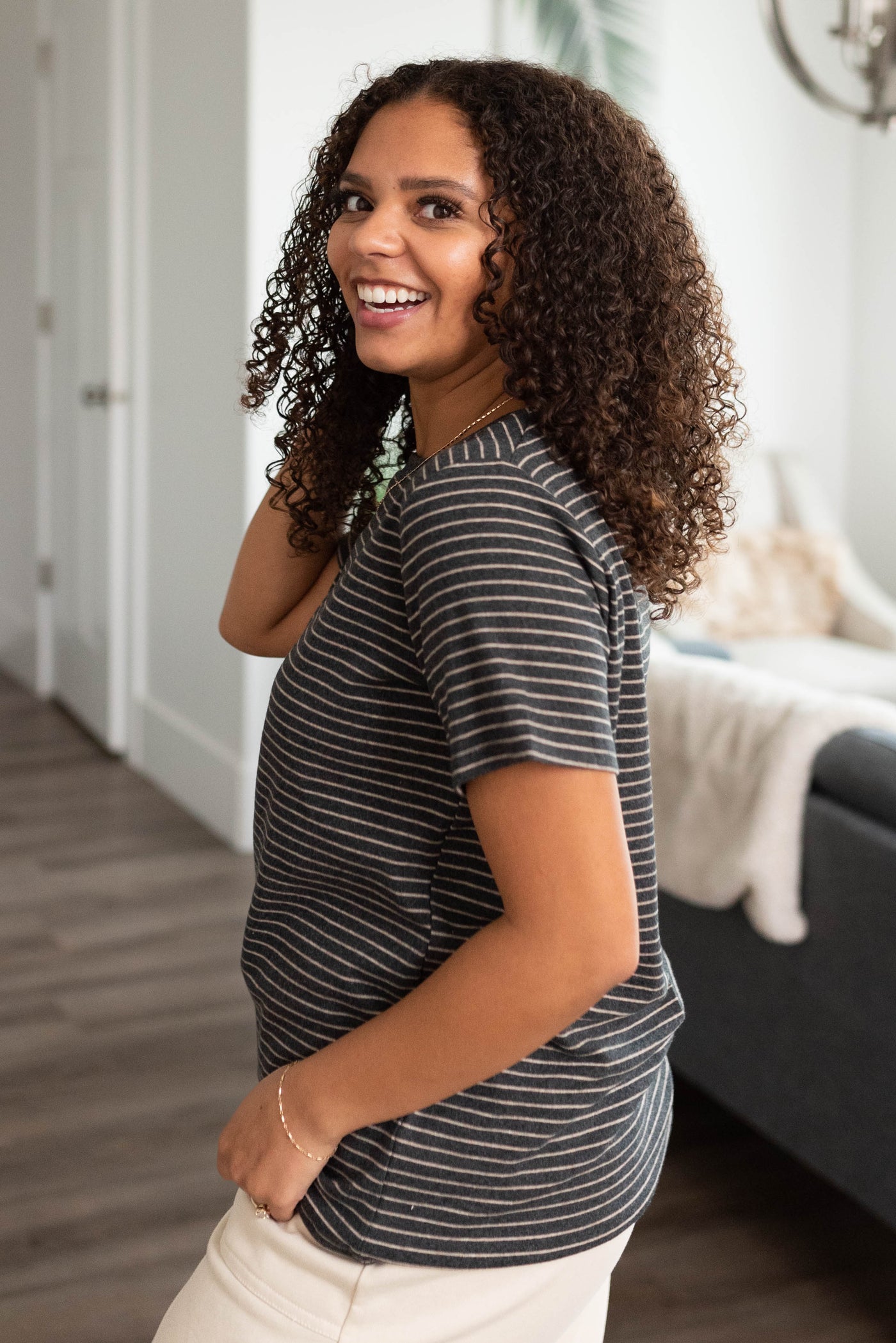 Side view of the charcoal stripe top