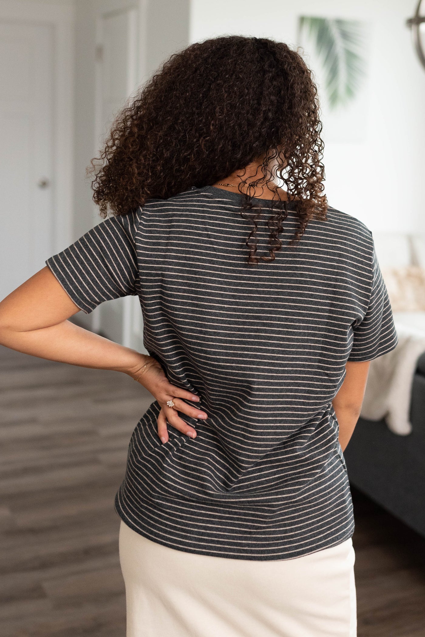 Back view of the charcoal stripe top