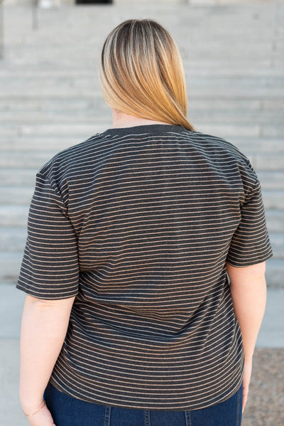 Back view of the plus size charcoal stripe top