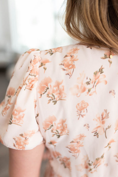 Close up of the fabric on the cream floral dress