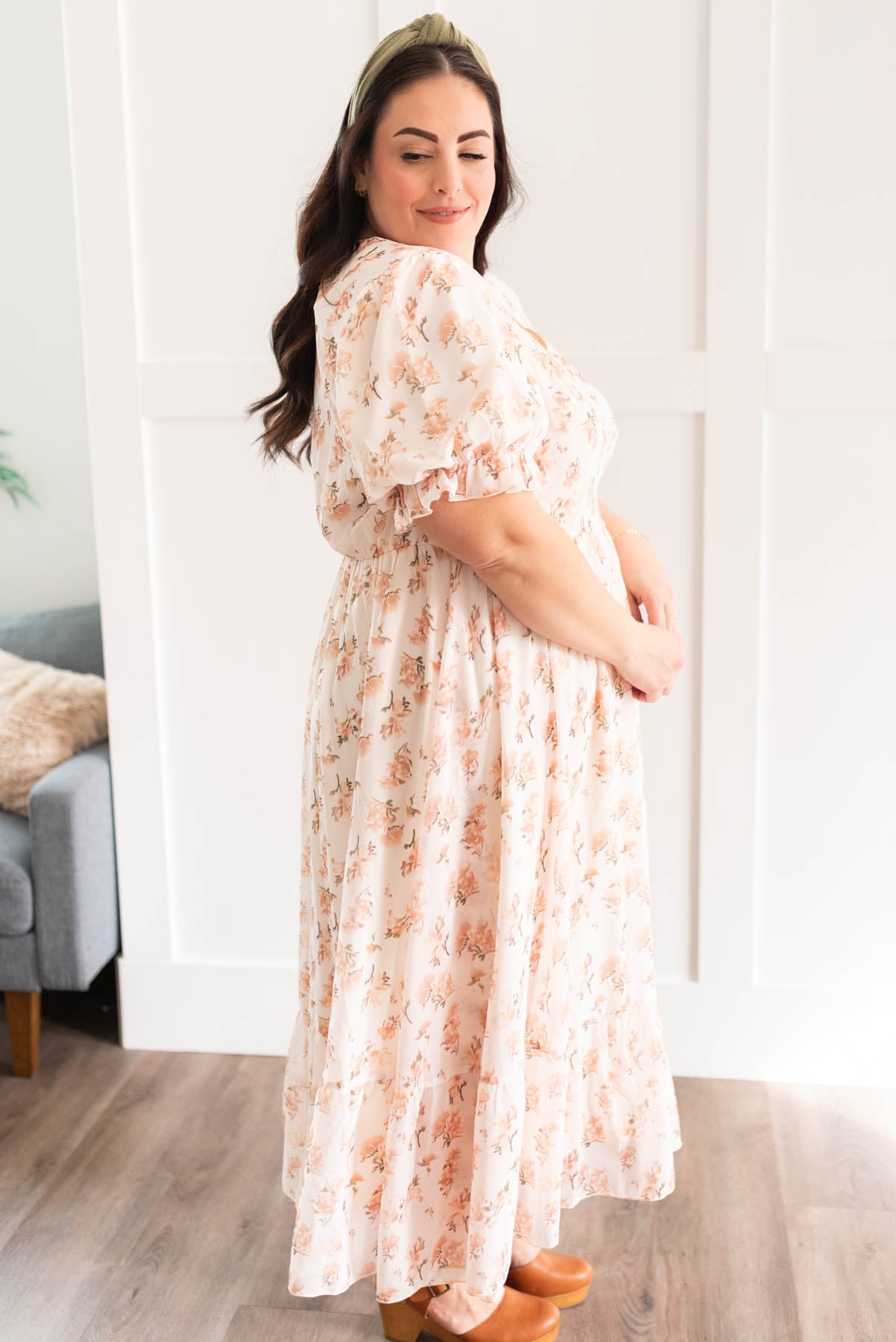 Side view of the plus size cream floral dress