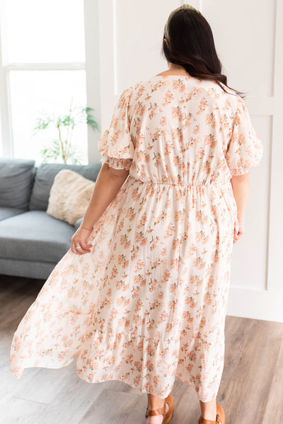 Back view of the plus size cream floral dress