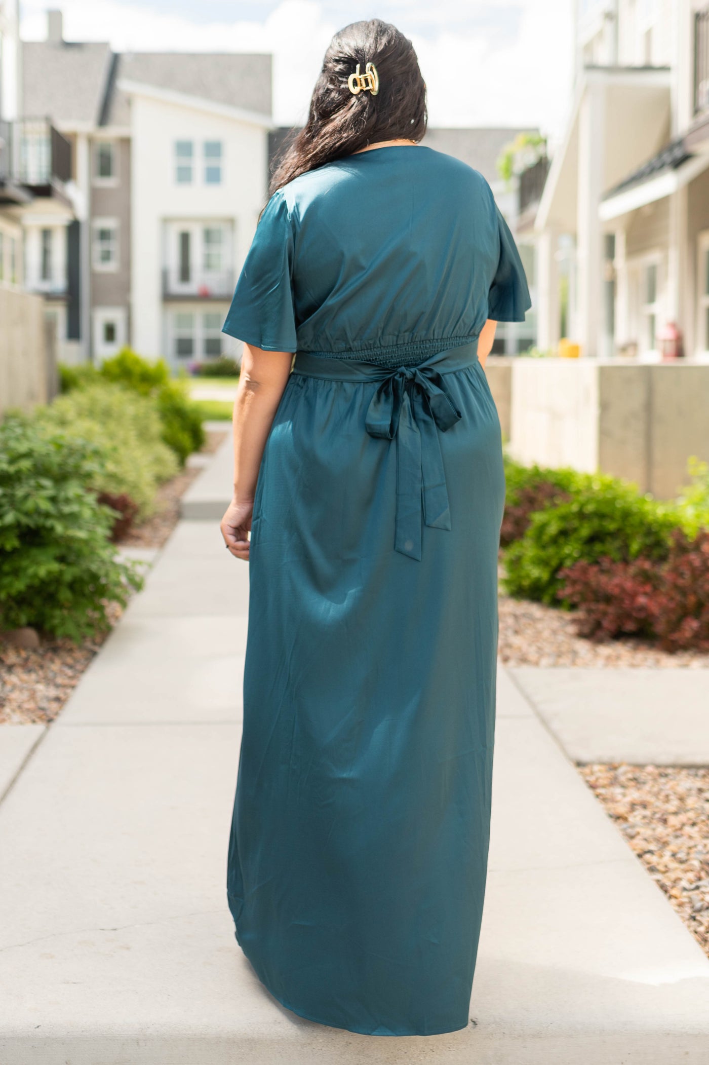 Back view of a deep teal dress