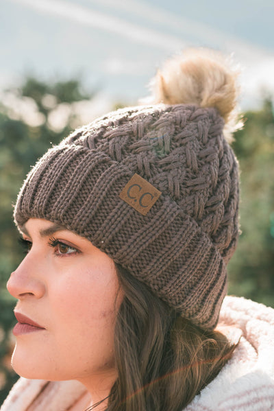 Side view of the brown C.C beanie