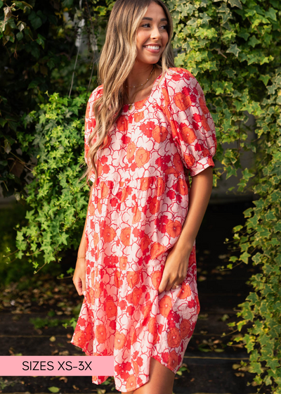 Pink floral dress with a tiered skirt