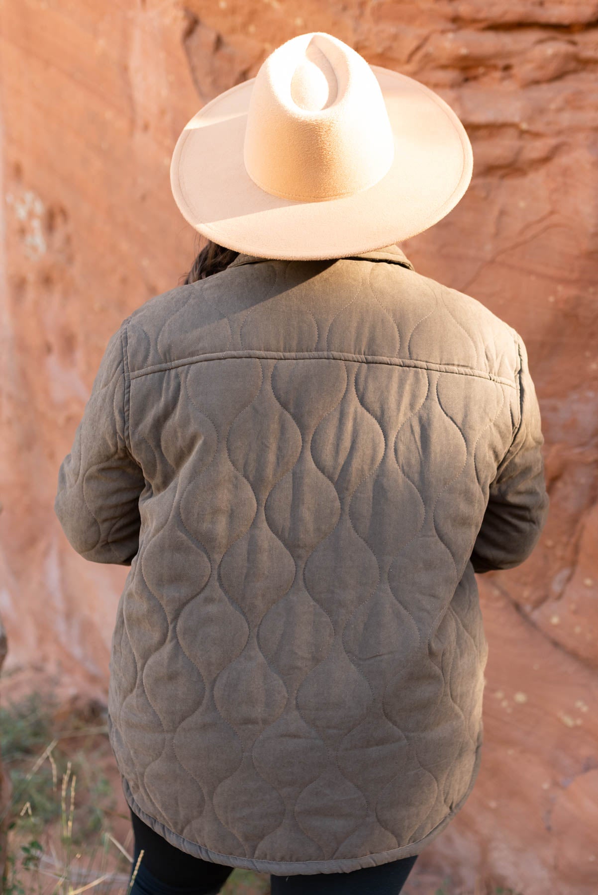 Back view of a plus size dark brown coat
