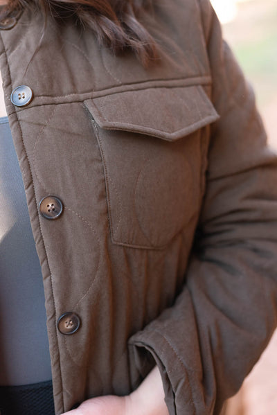 Close up detail of a plus size dark brown coat