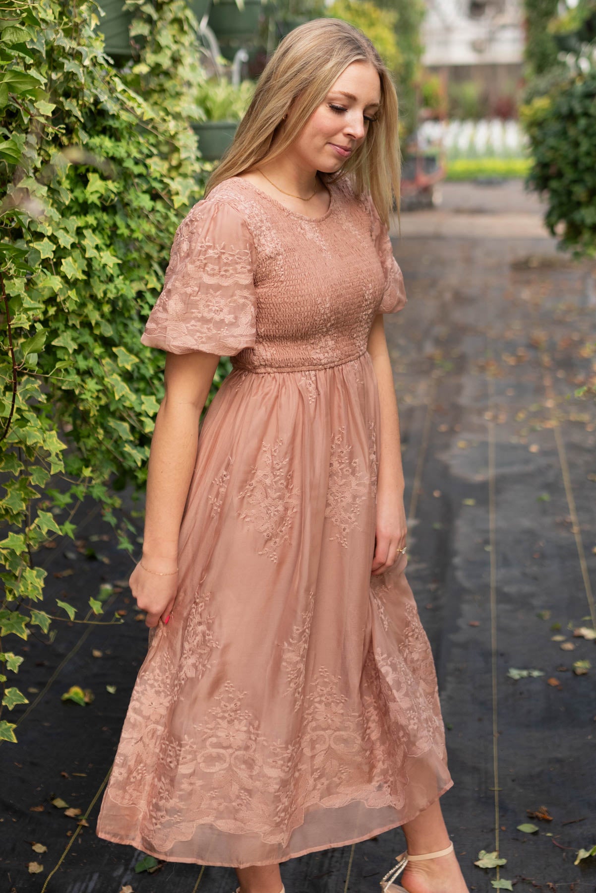 Side view of the dusty pink embroidered dress