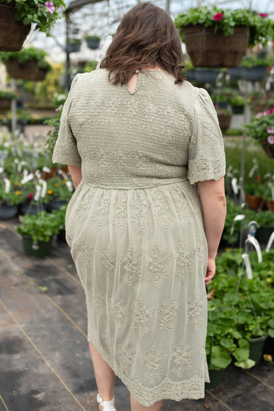 Back view of the plus size sage embroidered dress